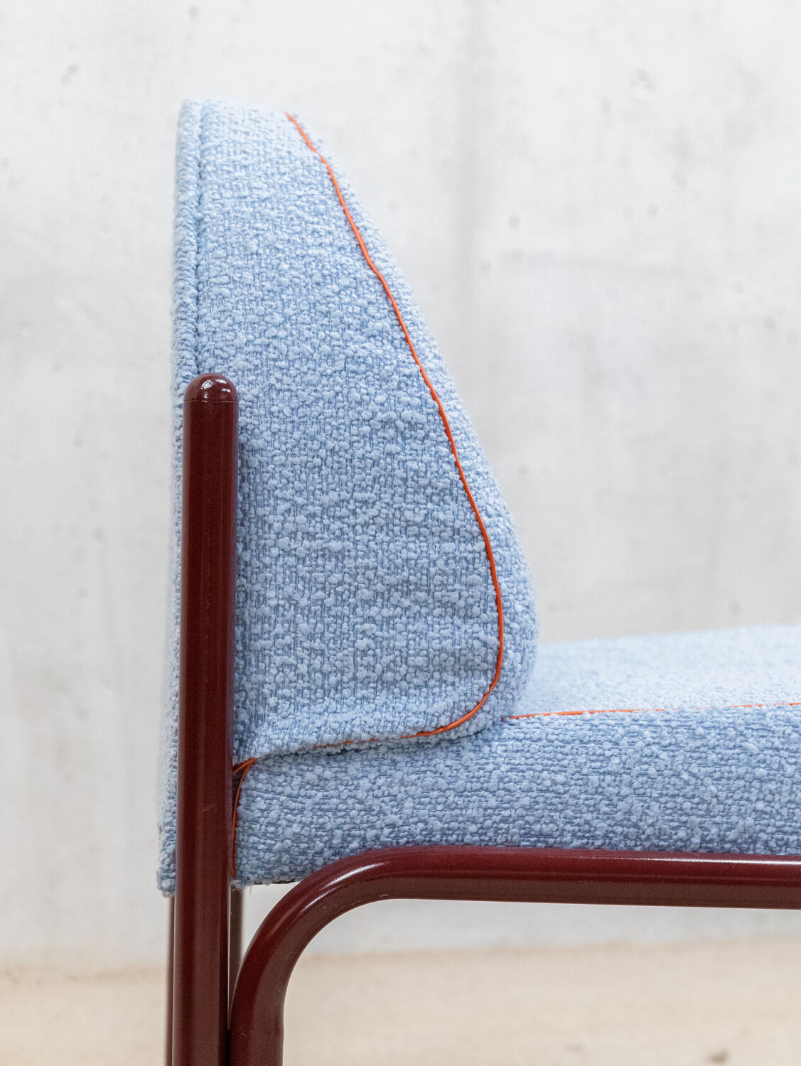 Souvignet armchair reupholstered in sky blue boucle.