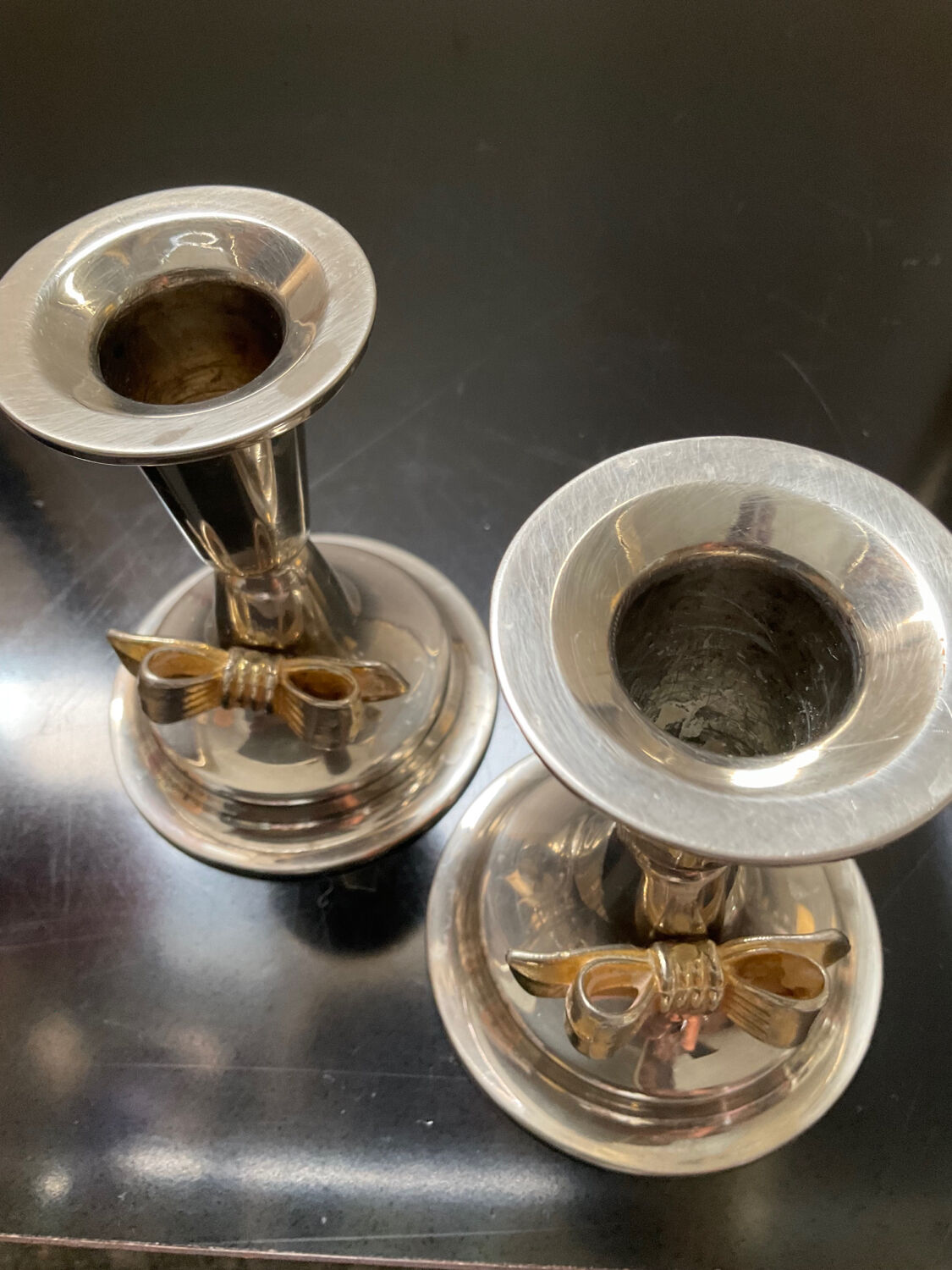 Pair of vintage candle holders in silver metal and brass