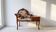 Antique wooden telephone bench in dark brown.