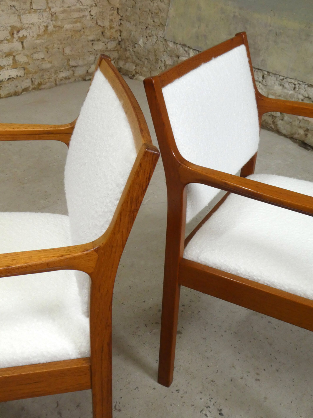 pair of Scandinavian teak armchairs and white buckles