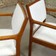 pair of Scandinavian teak armchairs and white buckles