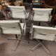 Suite de 4 fauteuils en cuir blanc Ray et Charles Eames