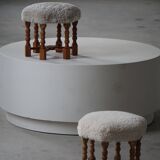 Pair of mid-century Danish oak stools with shearling lambswool upholstery, 1950s.