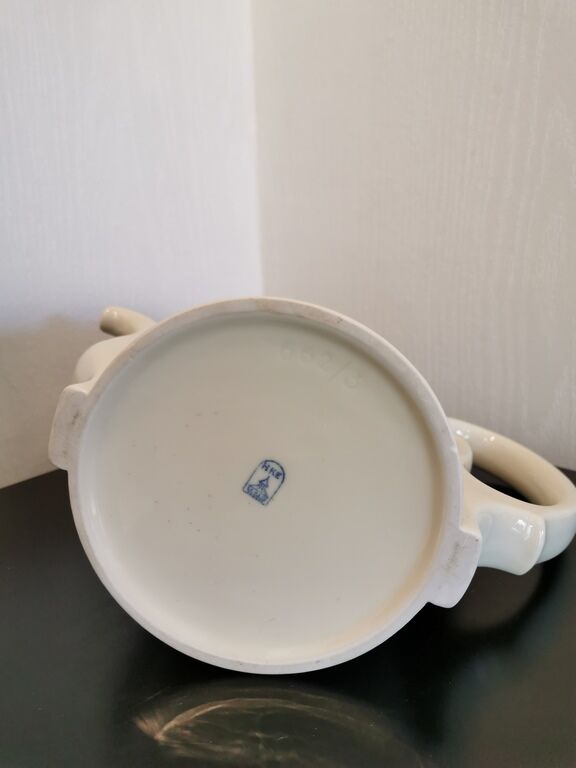 Silver-plated ceramic jug