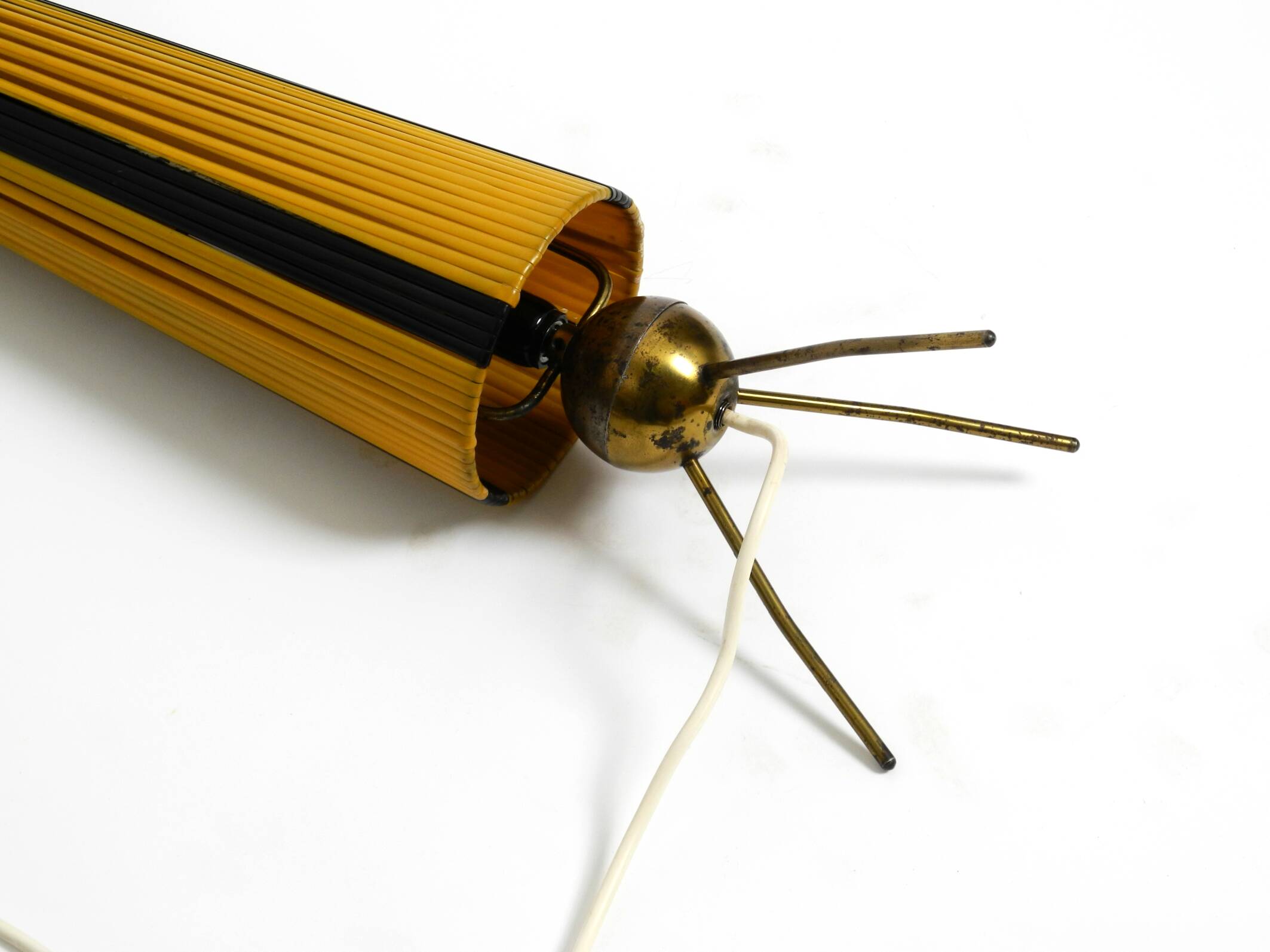 Mid Century tripod brass table lamp with a wrapped nylon strip lampshade