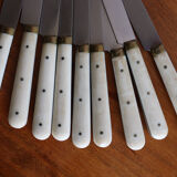 Set of 9 vintage cream table knives