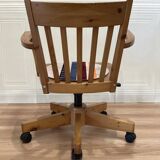 Solid wood swivel and reclining armchair.