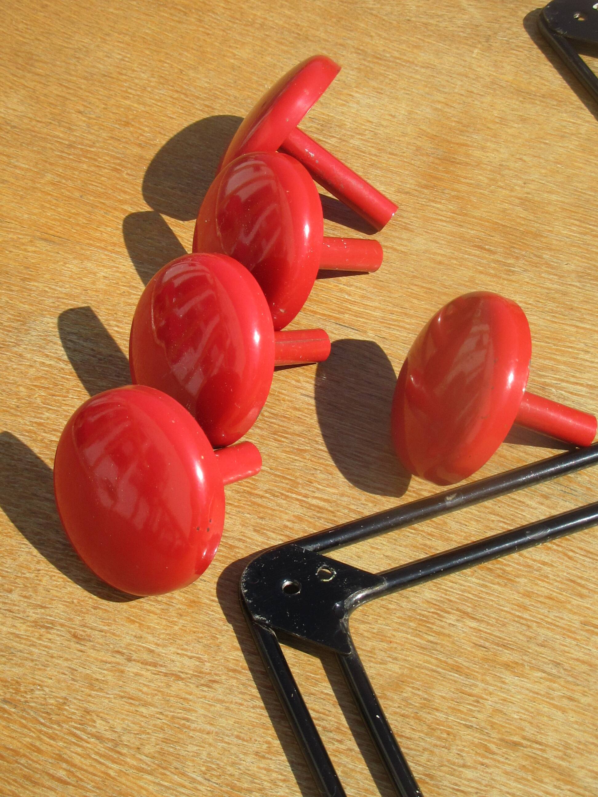 vintage black and red iron coat rack