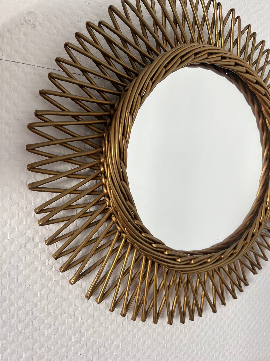Vintage gold rattan sun mirror