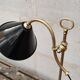 Old lamp in gilded bronze and brass with black enamel lampshade
