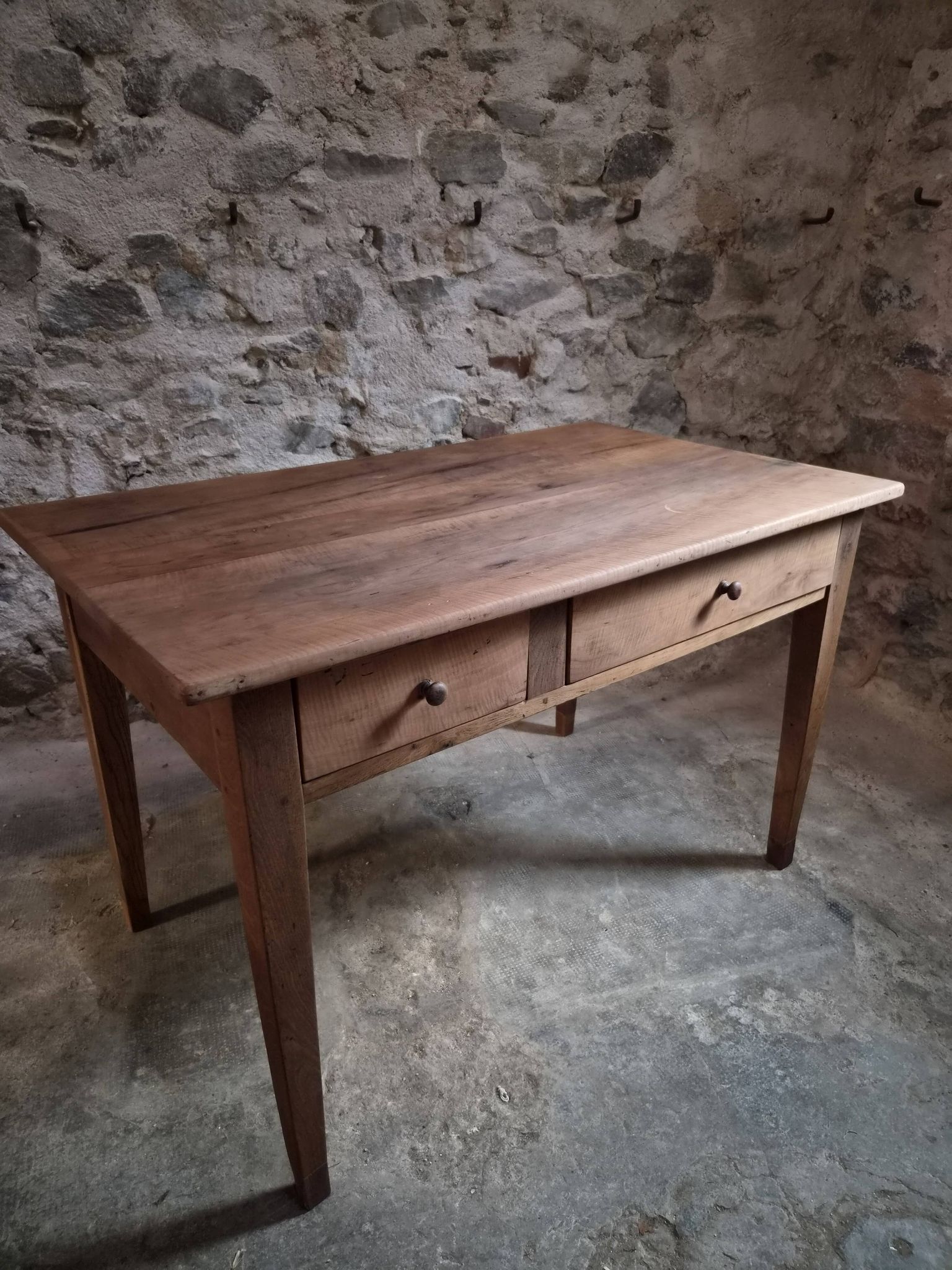 French antique dining table in cherry wood with two drawers, circa 1880–1920.