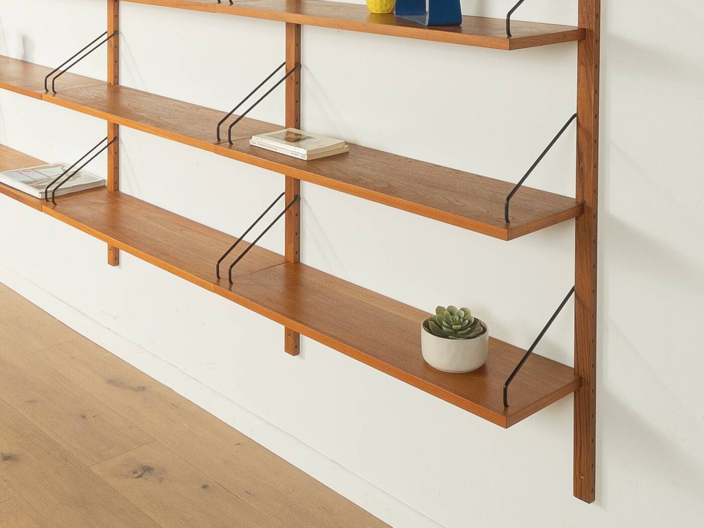 Classic wall shelf by Poul Cadovius for Cado, 1950s, teak veneer, 18 shelves, 4 ladders, Denmark