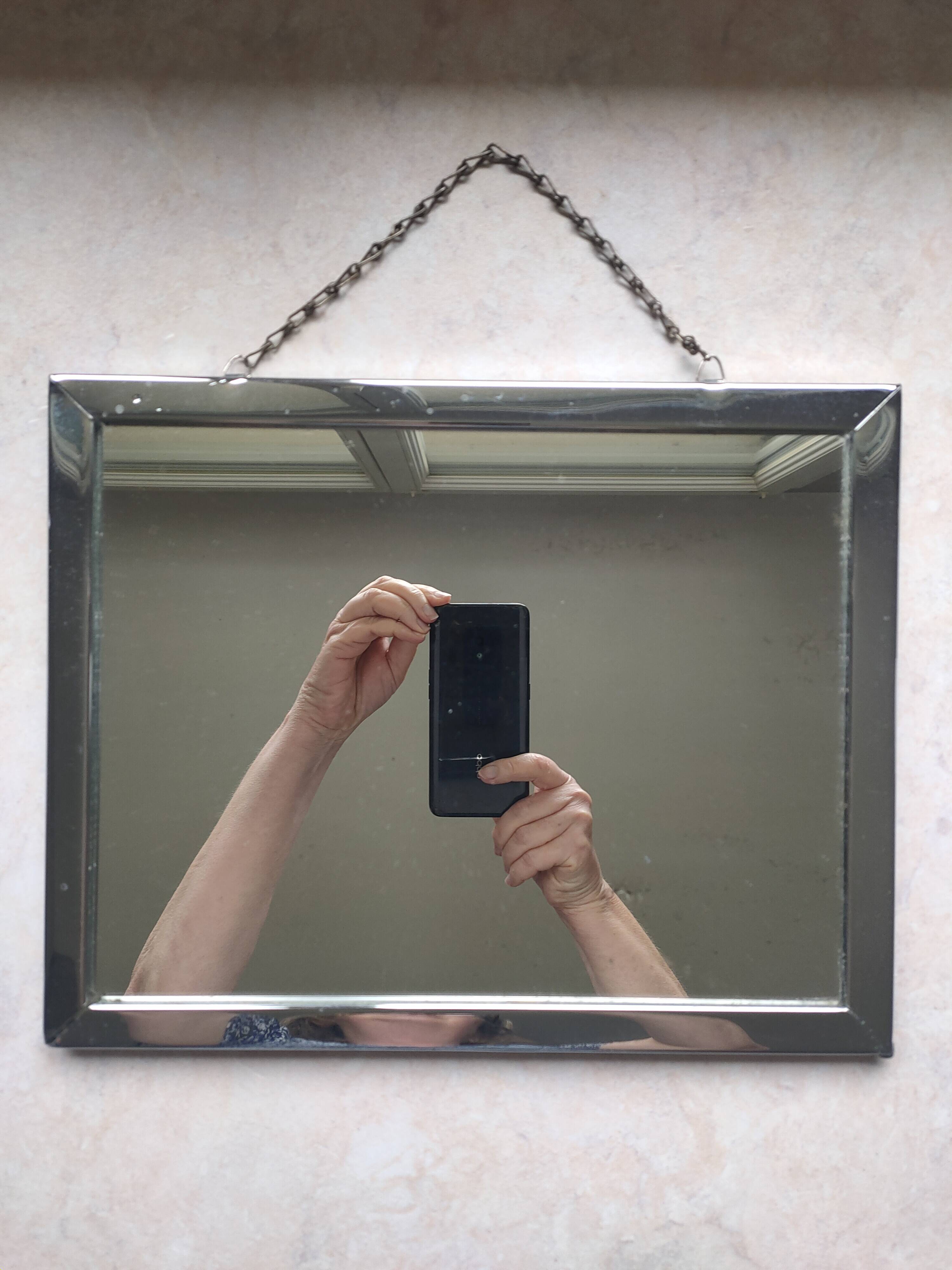 Barber mirror with chain.