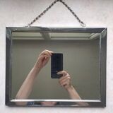 Barber mirror with chain.
