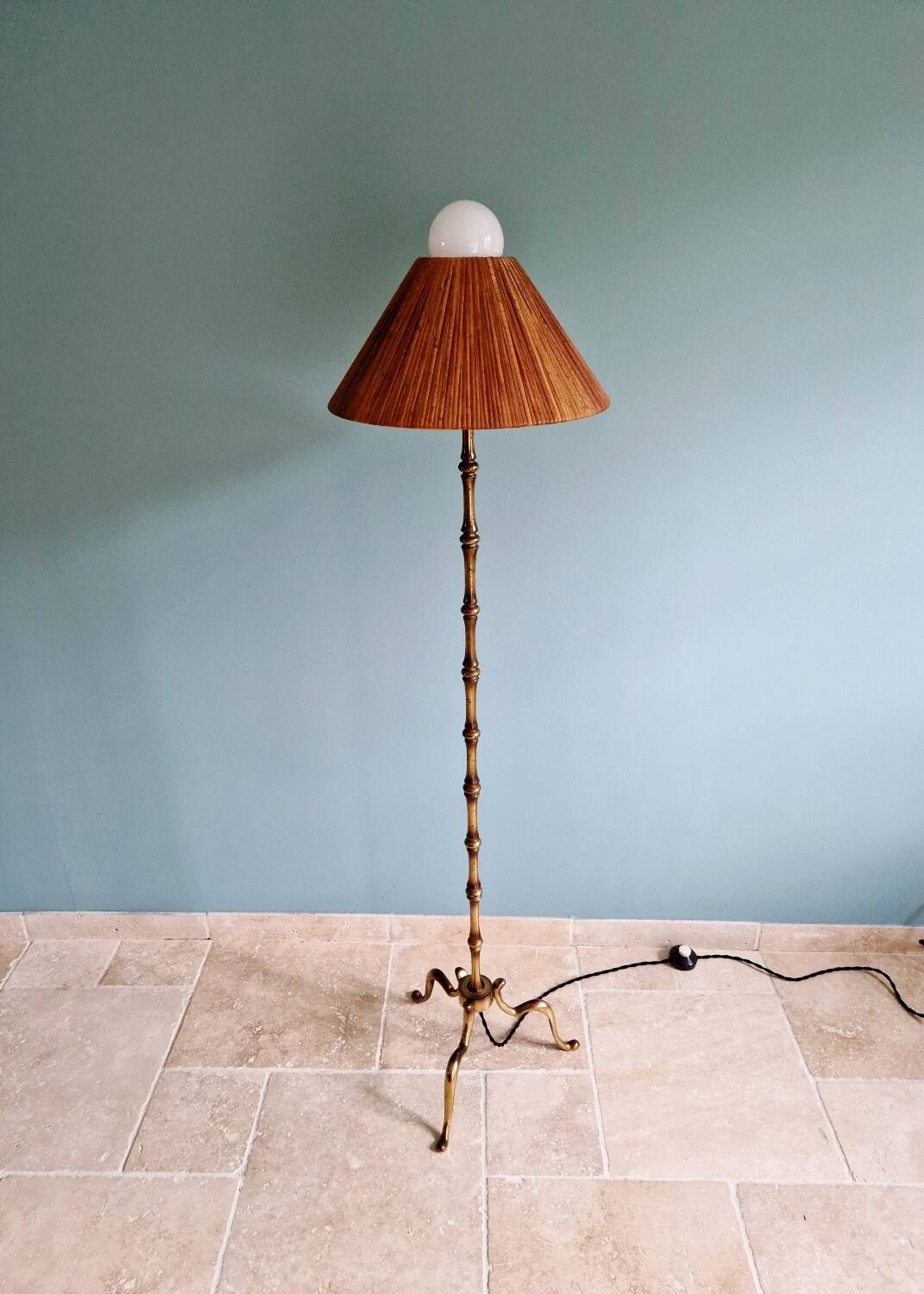 Brass floor lamp with rattan shade, 1950s-60s.