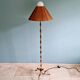 Brass floor lamp with rattan shade, 1950s-60s.