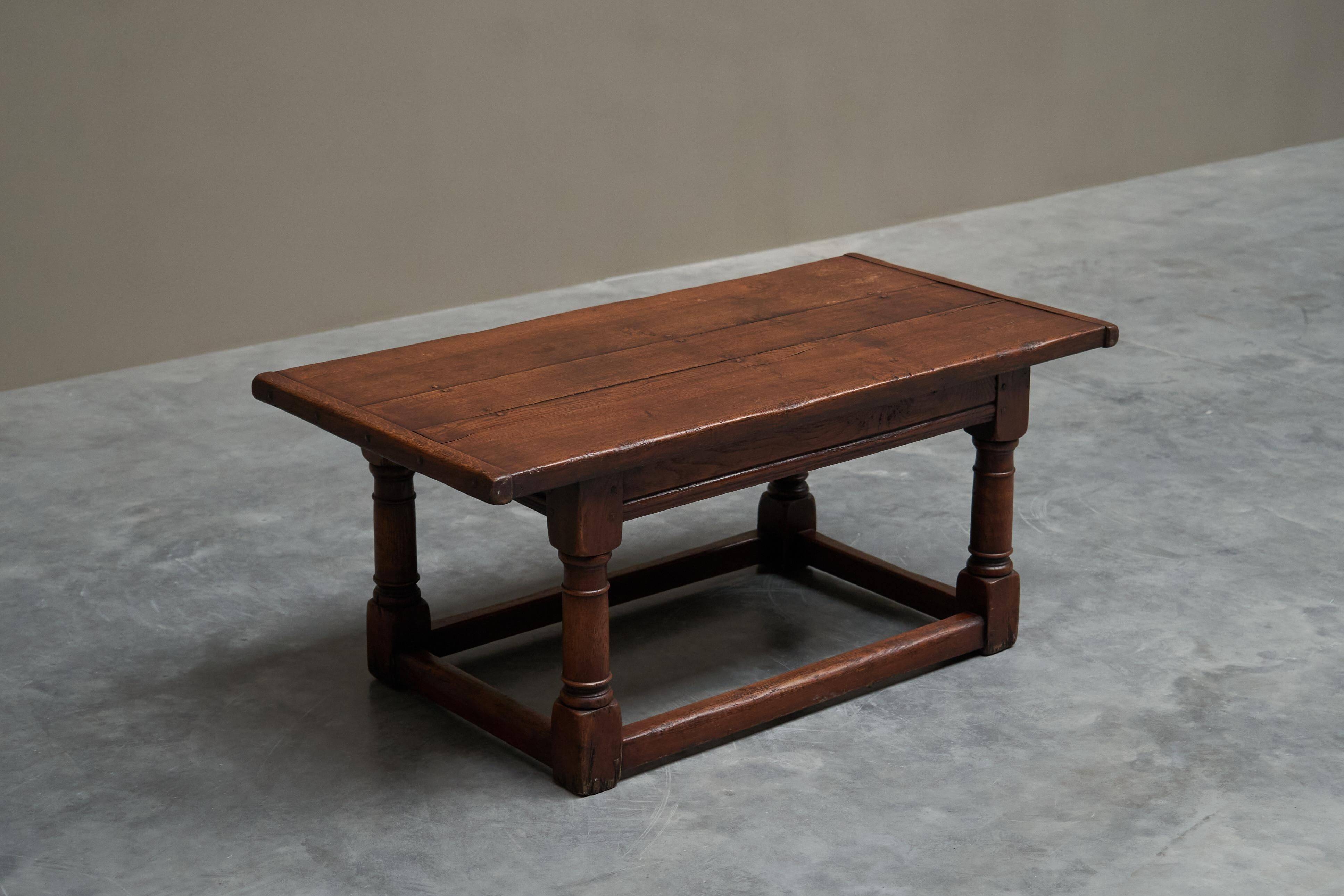 Antique solid oak coffee table in refectory style, 19th century.