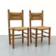 Pair of wooden chairs with seat and straw back