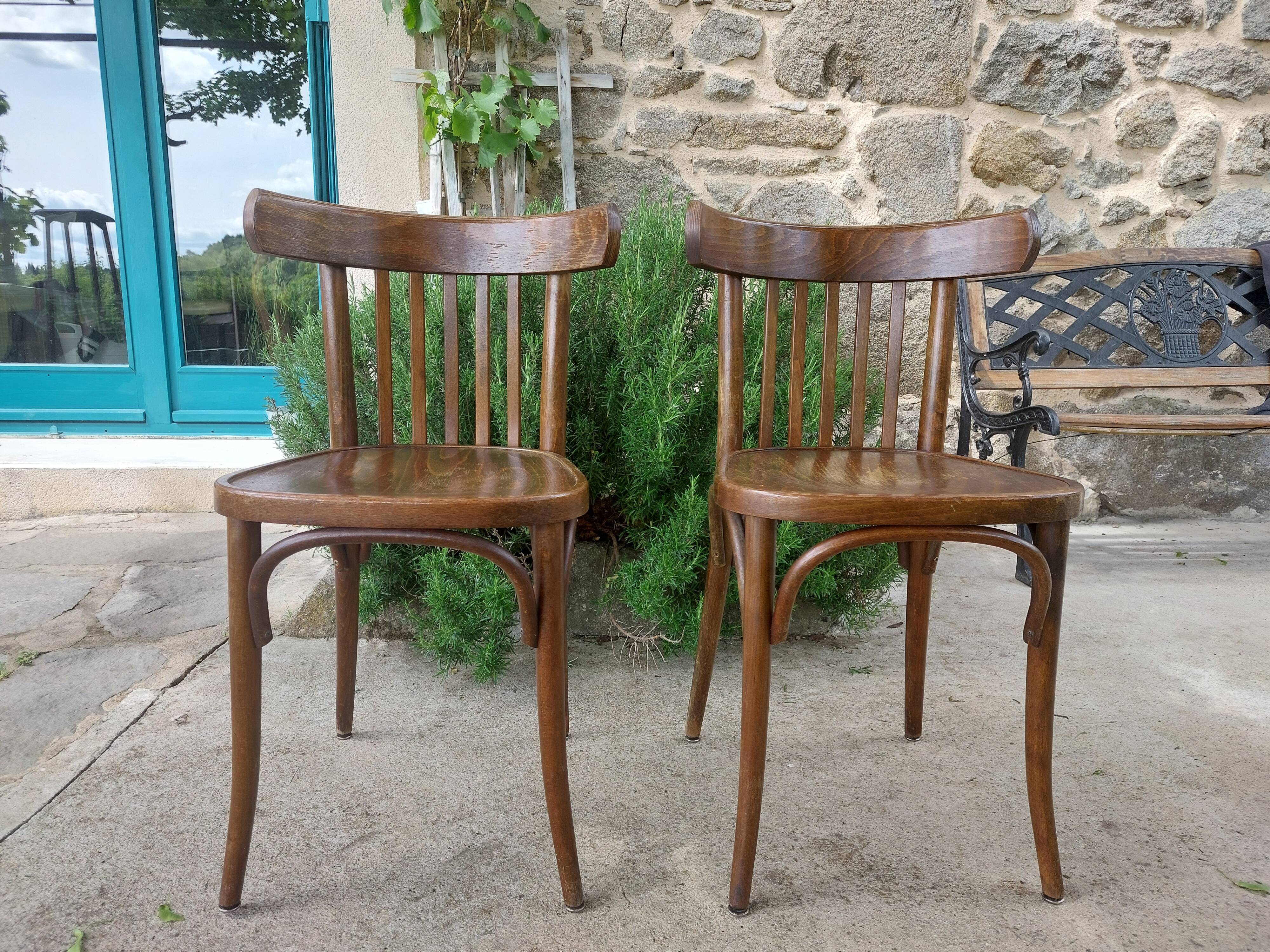 pair of dark bistro chairs, rounded backs, Baumann style