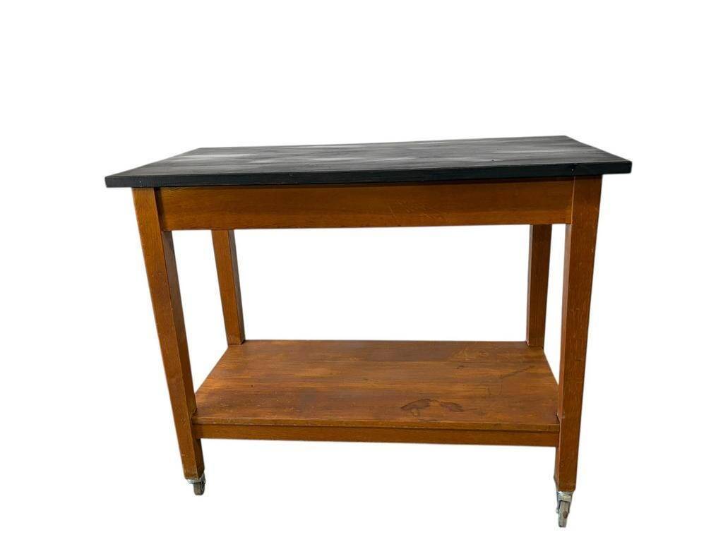 Vintage wooden high table on wheels