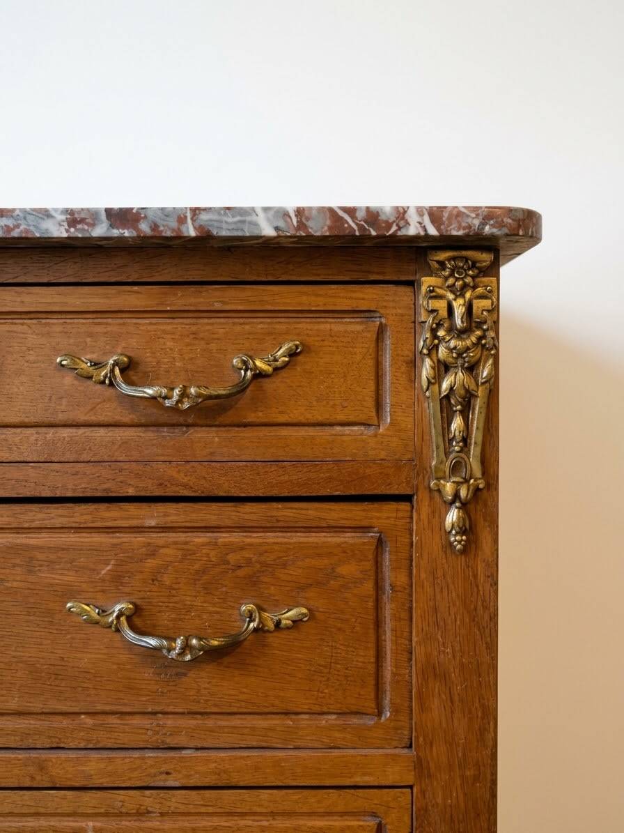 Antique wooden commode with marble and brass.