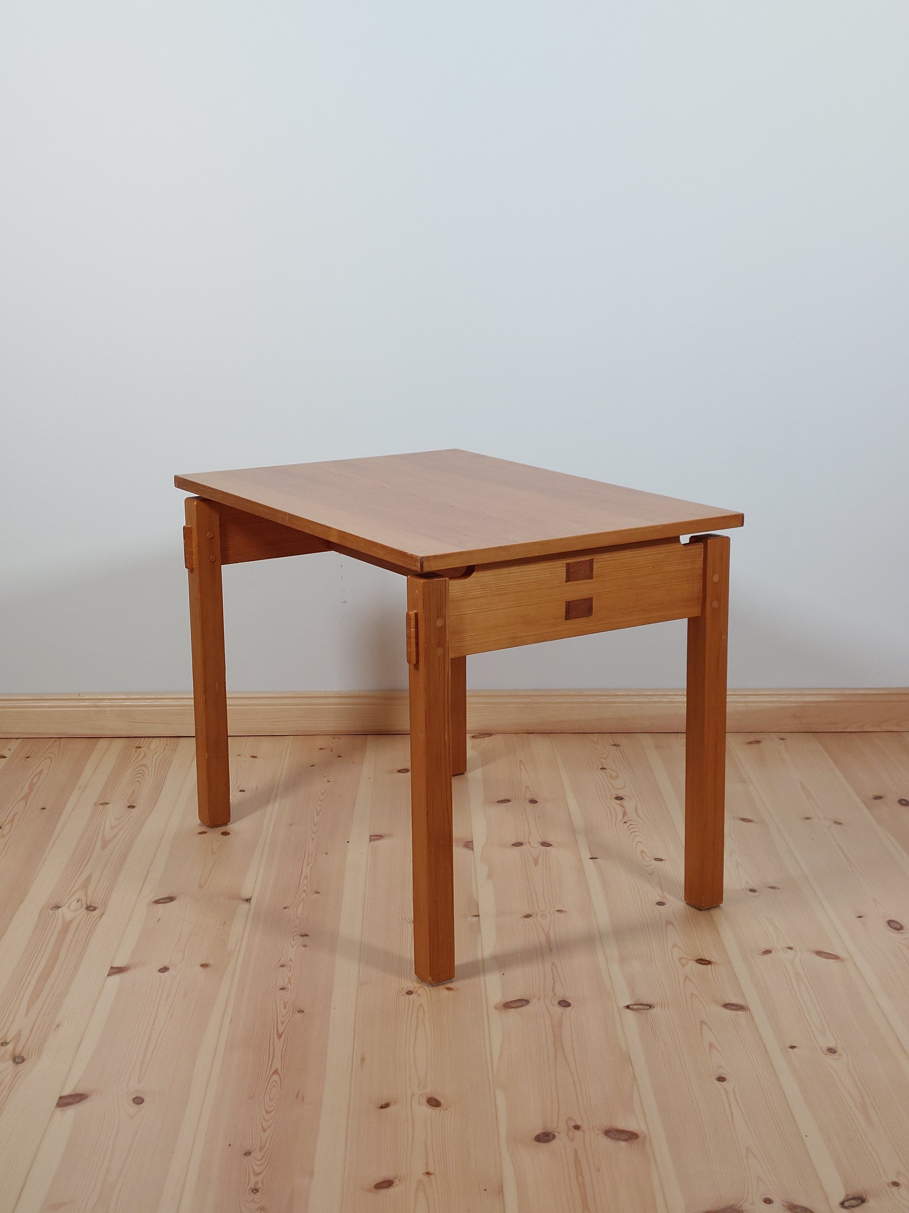 Meticulously crafted vintage pine side table, a masterpiece.