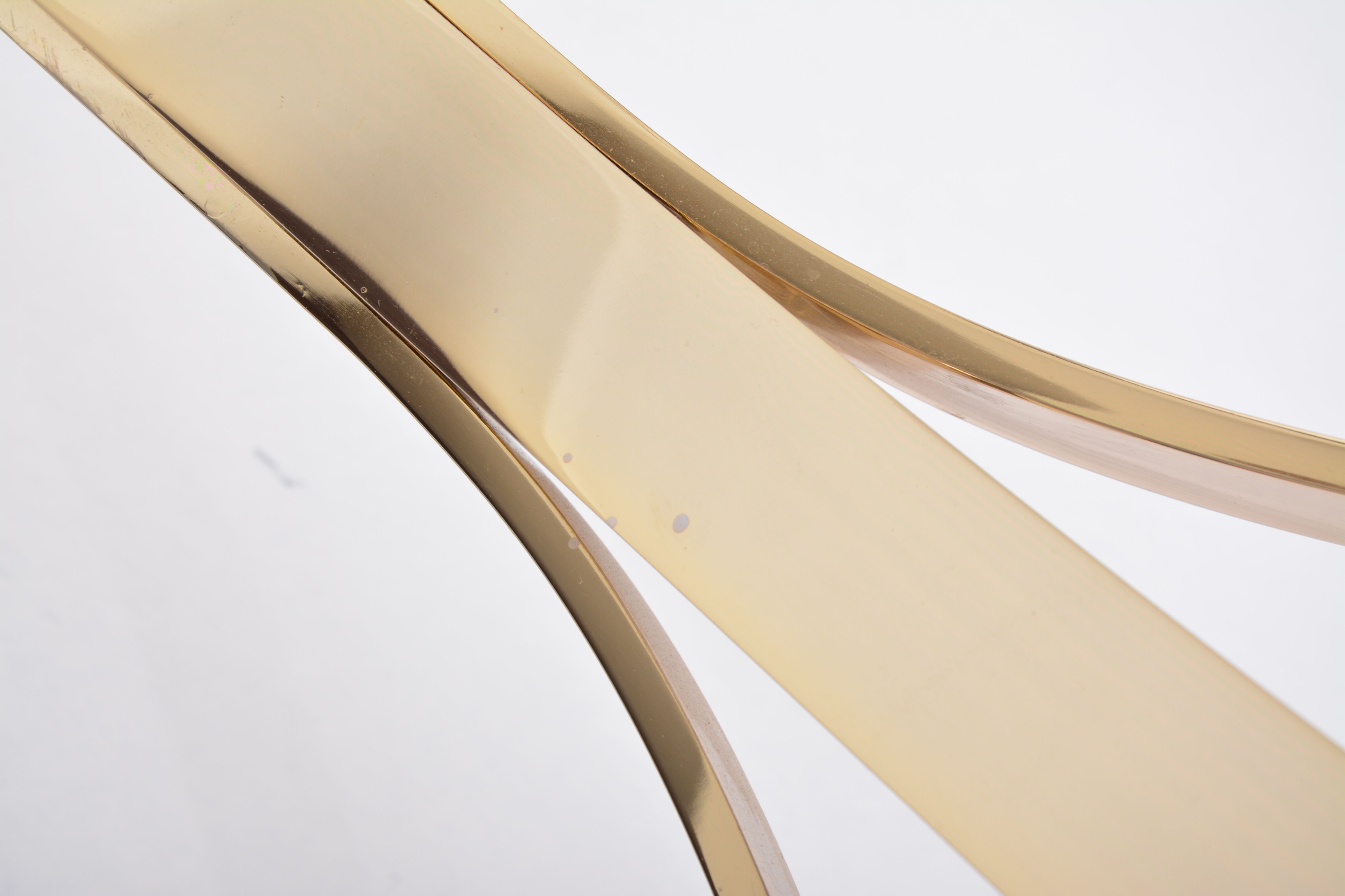 Gold Colored Mid-Century Modern coffee table with smoked Glass top