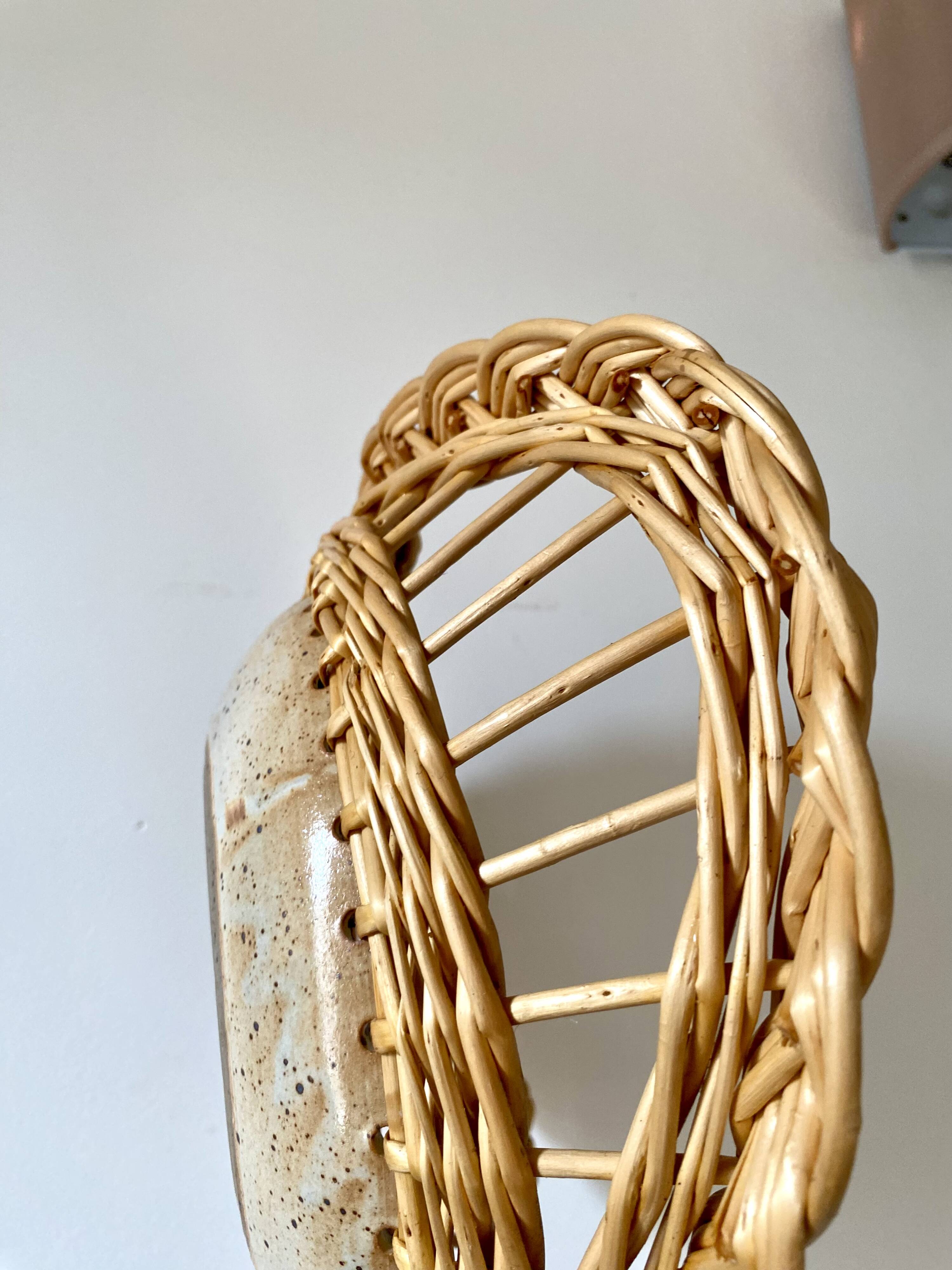 Wicker and ceramic piece signed, 1990s.