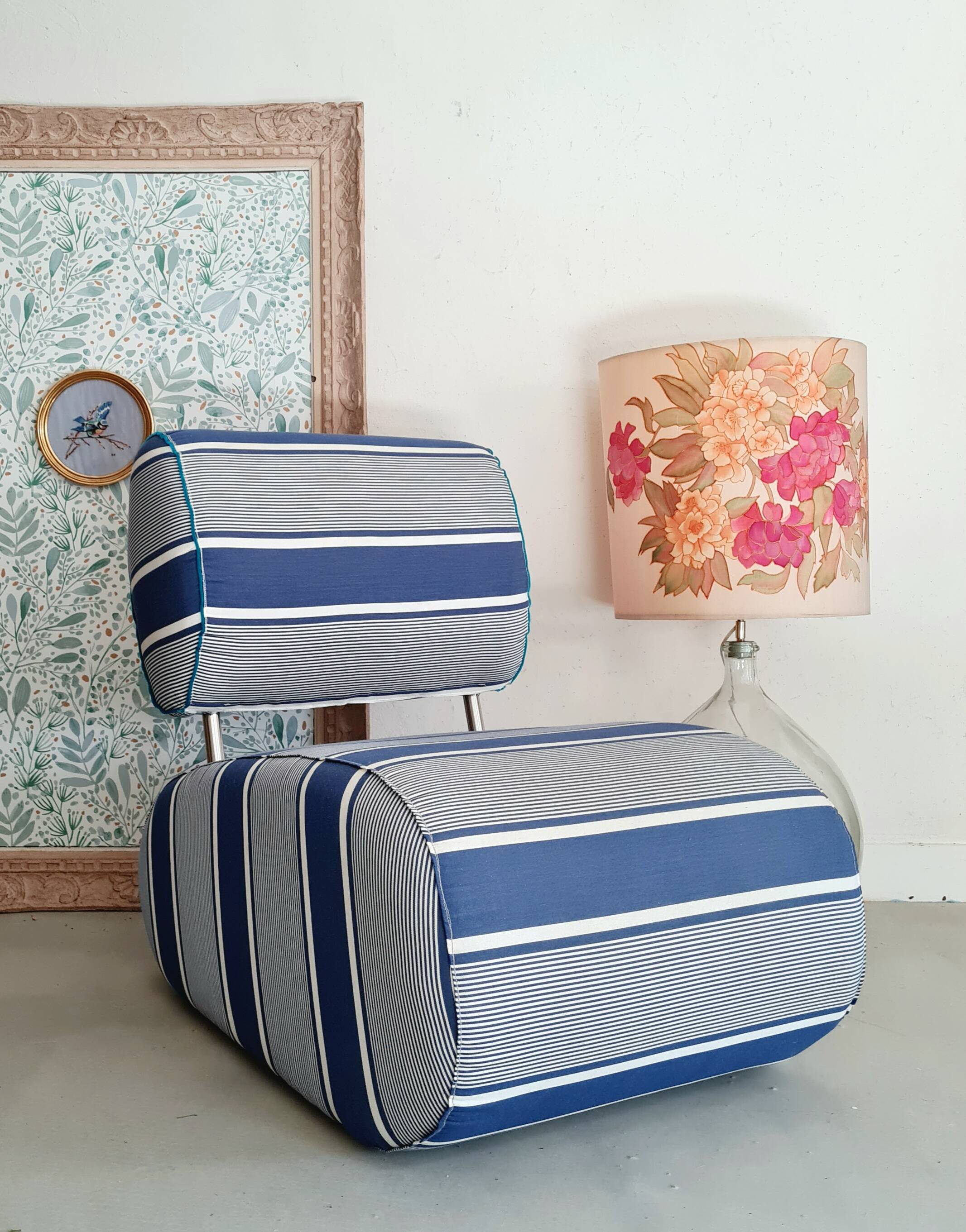 Curved armchair with blue and white stripes