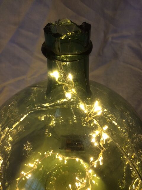 Demijohn old transparent green, estimated capacity around 12 to 15L