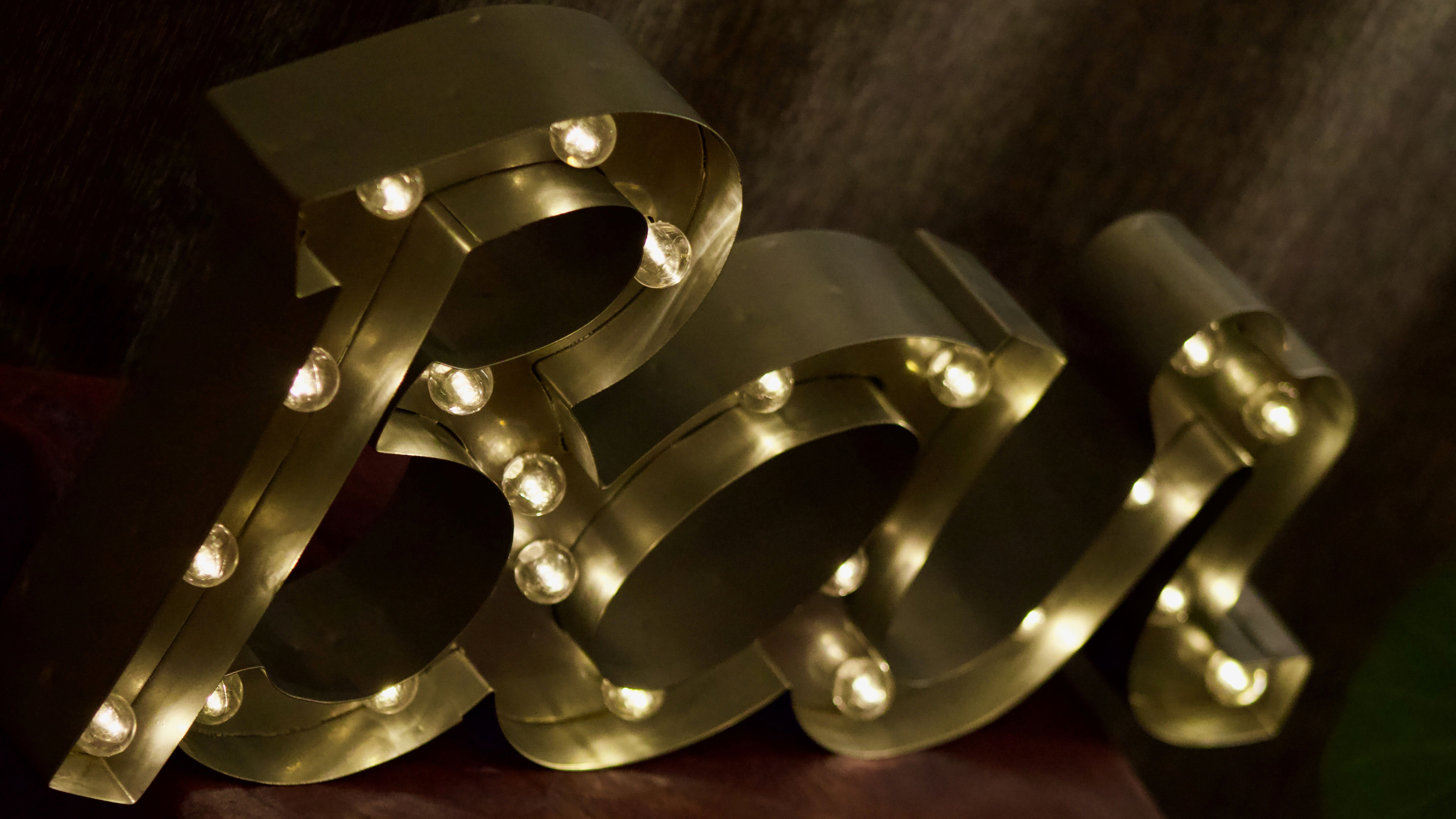 Ancient Light Sign in aluminium lettering forming the word "BAR"