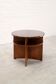 French modernist circular coffee table with integrated shelving, c. 1935