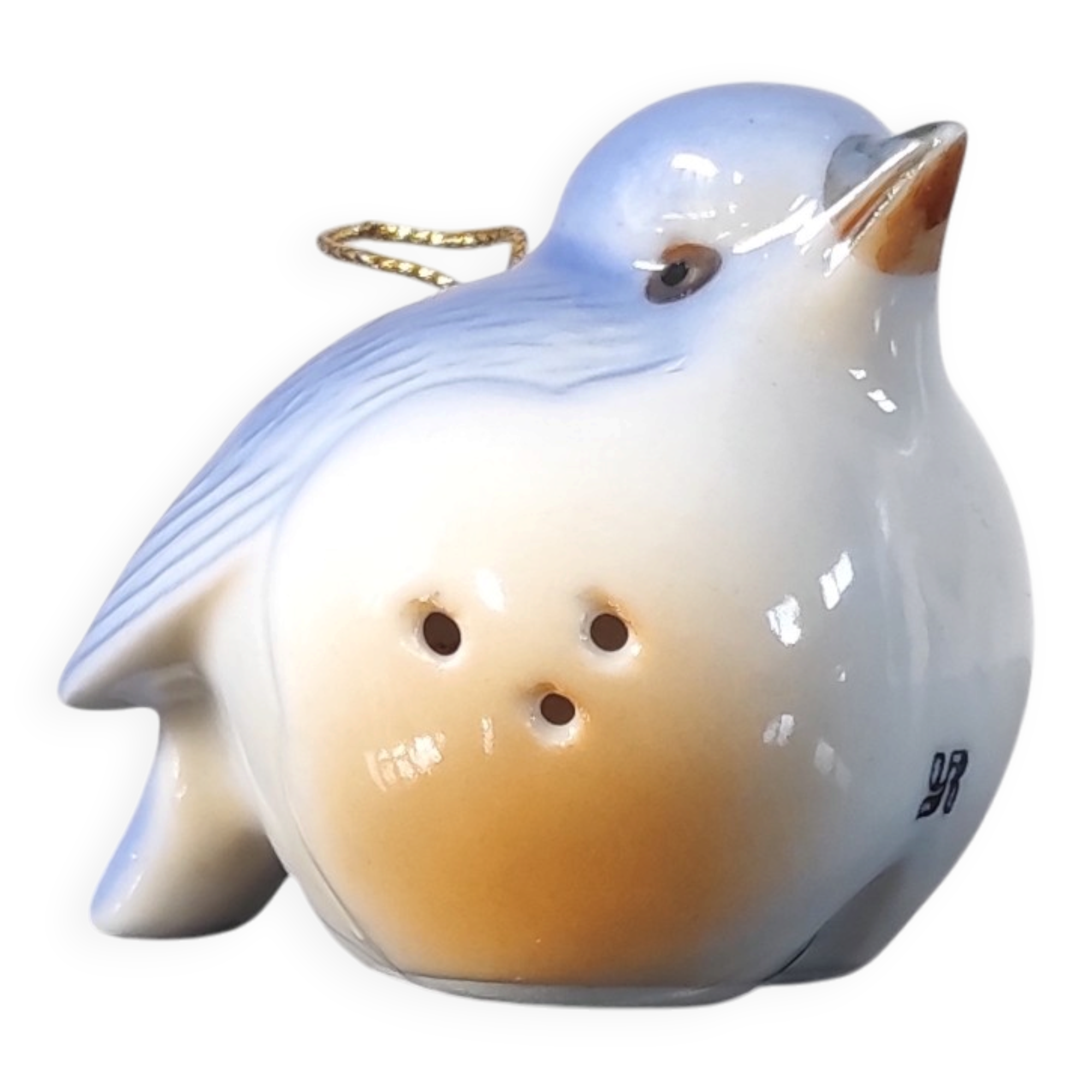 Vintage bird salt cellar in blue and white porcelain.