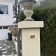Pair of garden vases in reconstituted stone, Médicis shape, patinated.