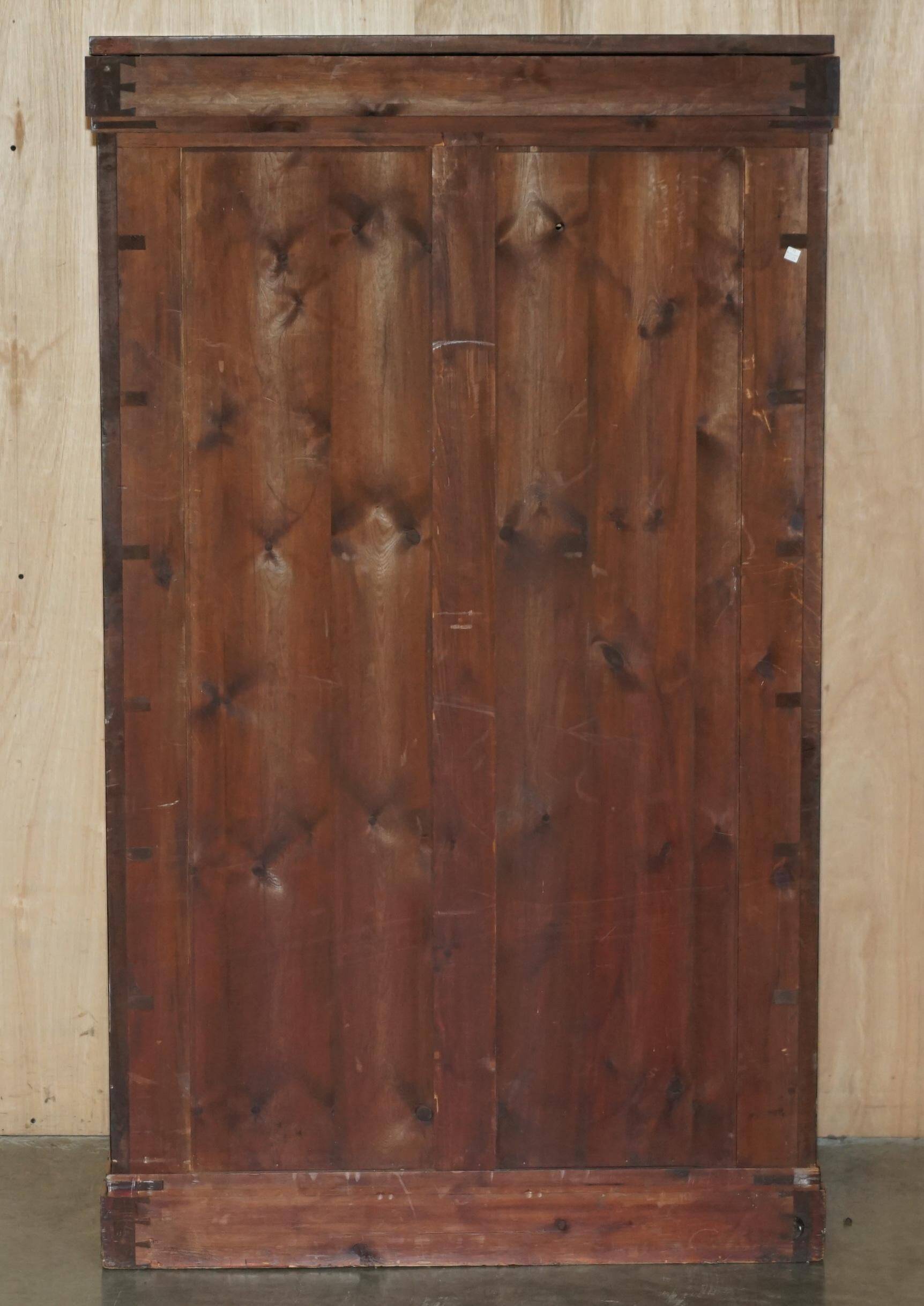 Pair of tall walnut chests of drawers with curved fronts in country style.