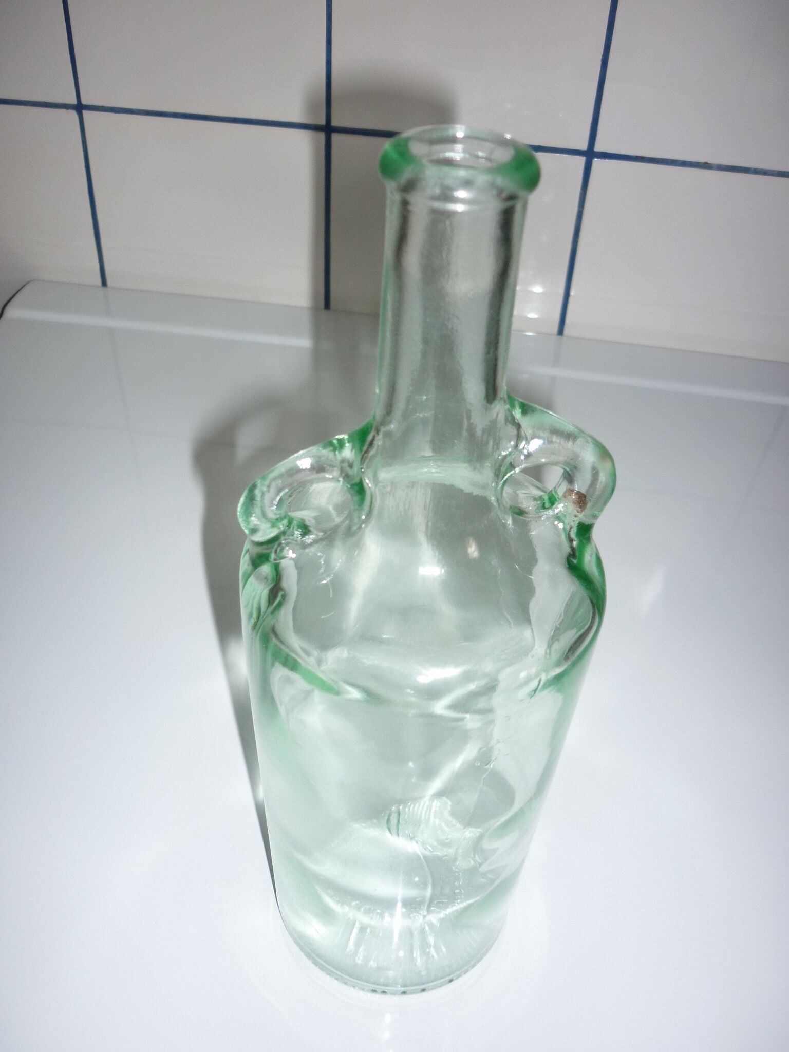 Old transparent moulded glass bottle