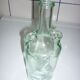 Old transparent moulded glass bottle