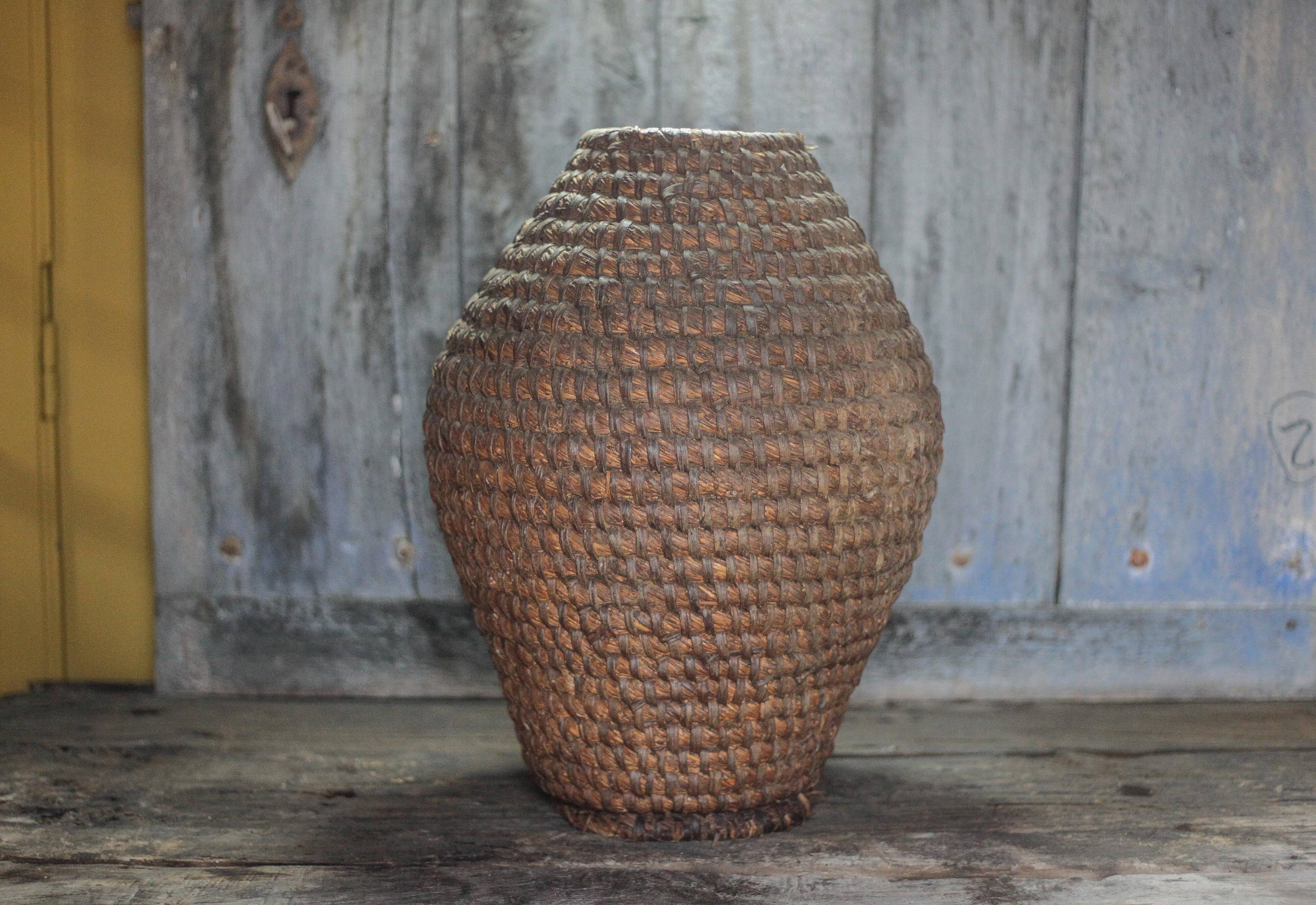 Old basket, straw and bramble bourgne, woven basket, interior decoration.