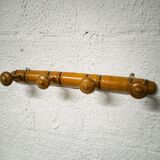 Turned wooden coat rack