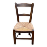 Solid wood chair in dark oak with rush seating, Louis Philippe style.
