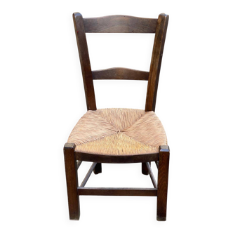 Solid wood chair in dark oak with rush seating, Louis Philippe style.