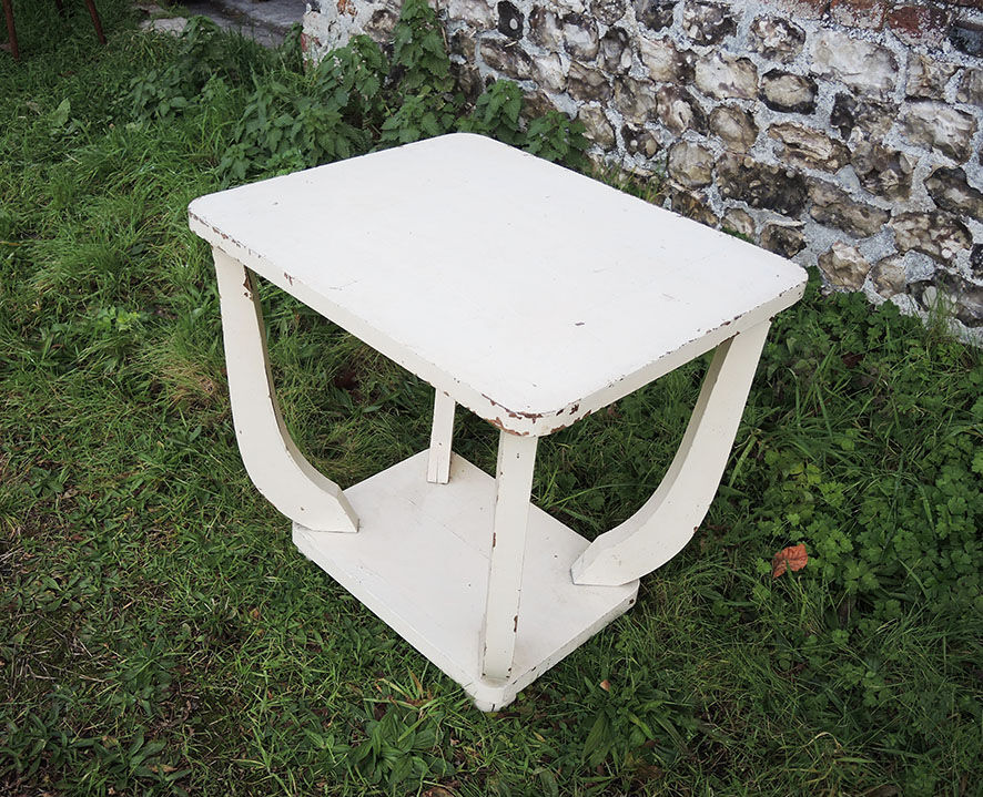Old white wooden peestal table in art deco style