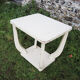 Old white wooden peestal table in art deco style