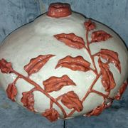 Large vase with relief plant decoration, raw art.