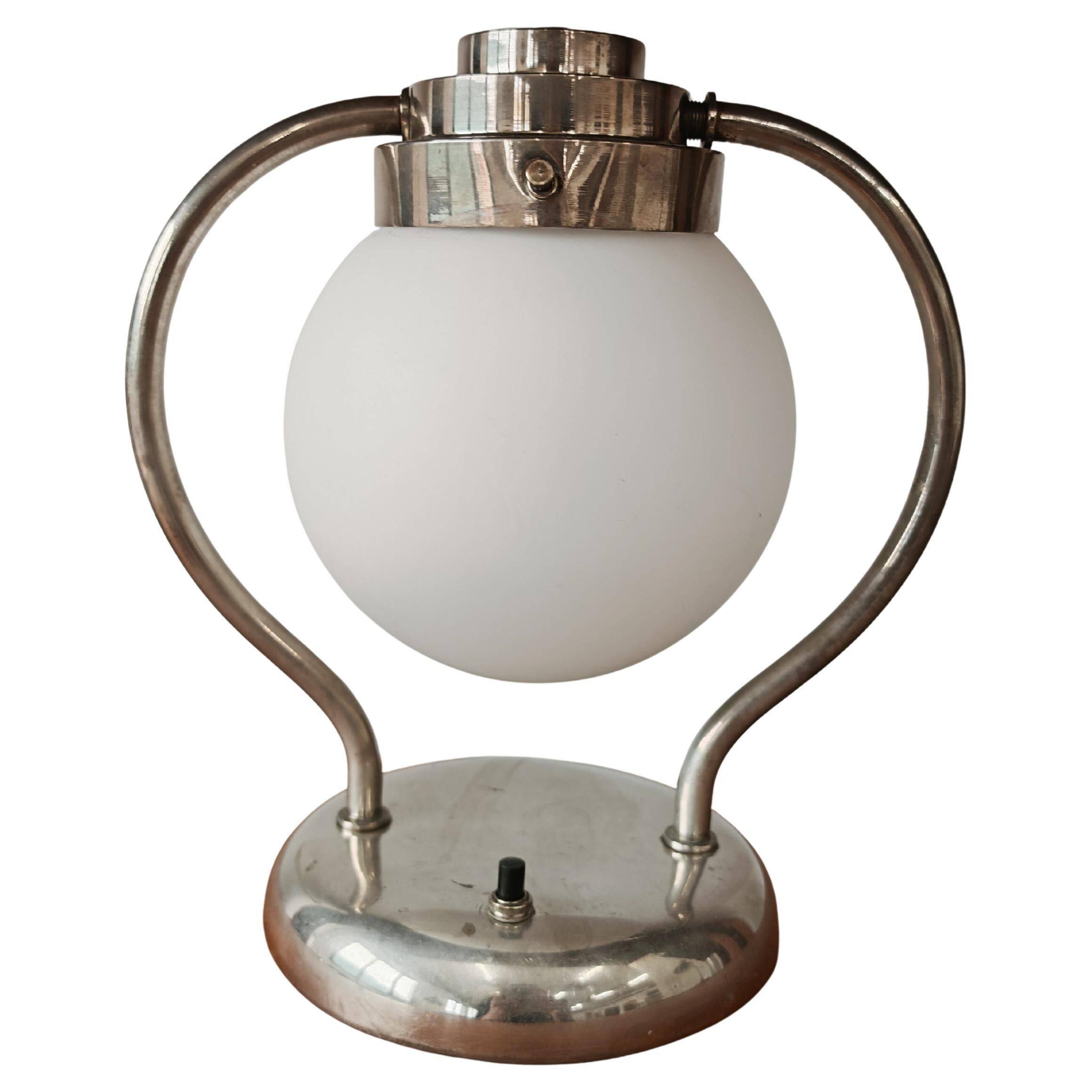 Art Deco table lamp with a spherical opaline glass shade and chrome base from the 1930s.