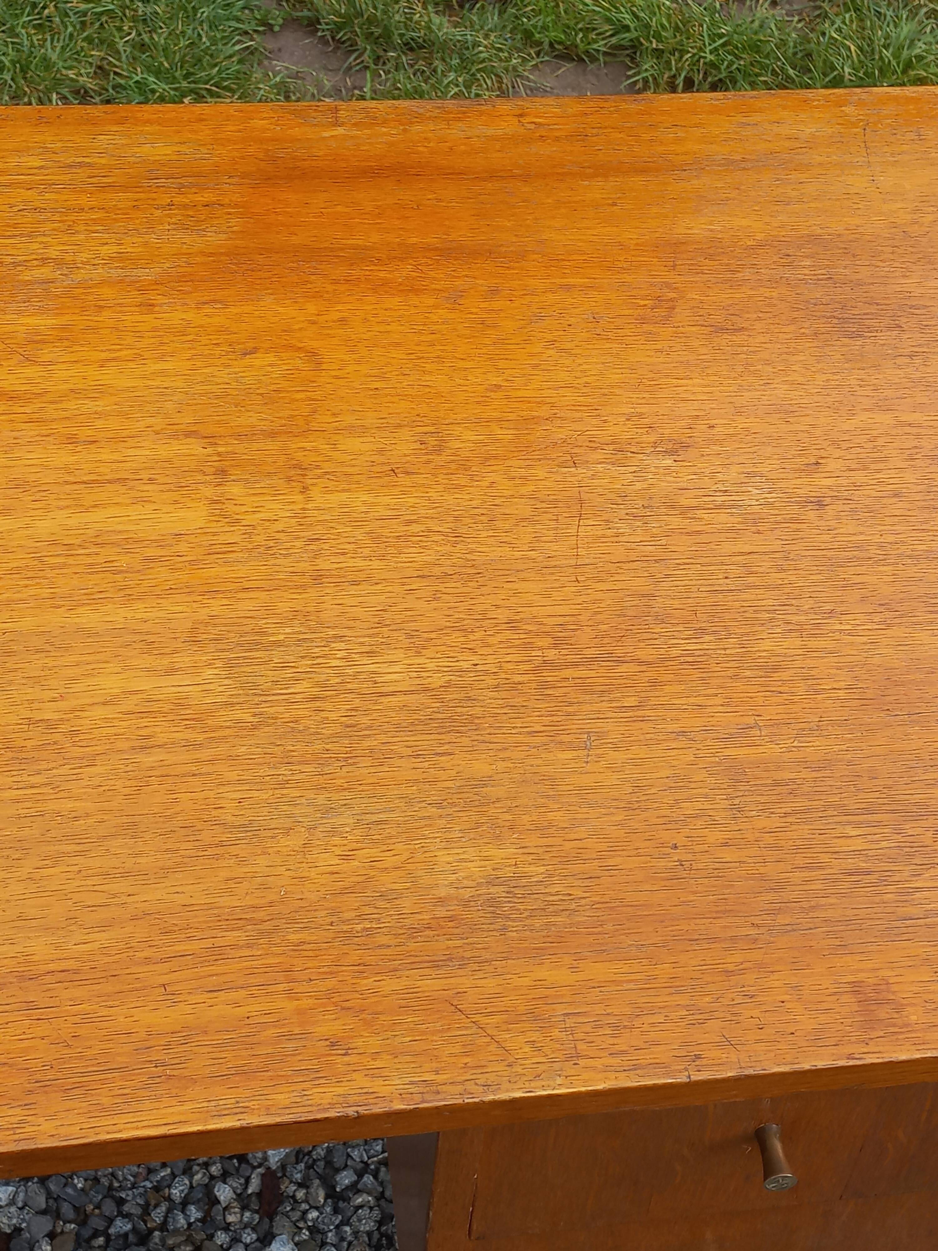 Vintage oak desk with a metallic base from the 1960s.
