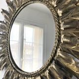 Miroir soleil métal doré