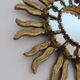 Miroir soleil en bois doré avec incrustations début XXème