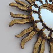 Golden wooden sun mirror with inlays from the early 20th century.