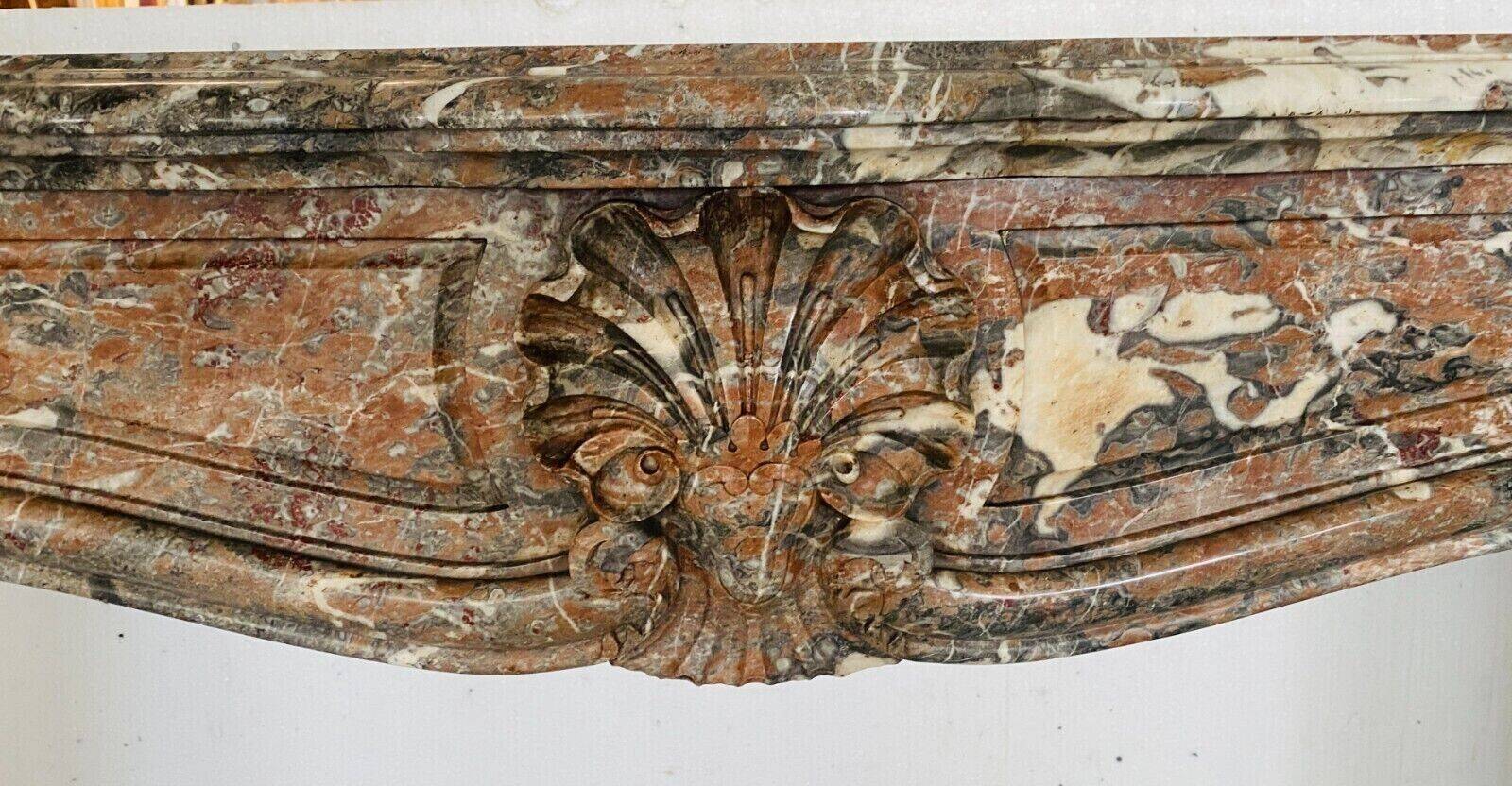Louis XV style fireplace in red breche marble 19th century